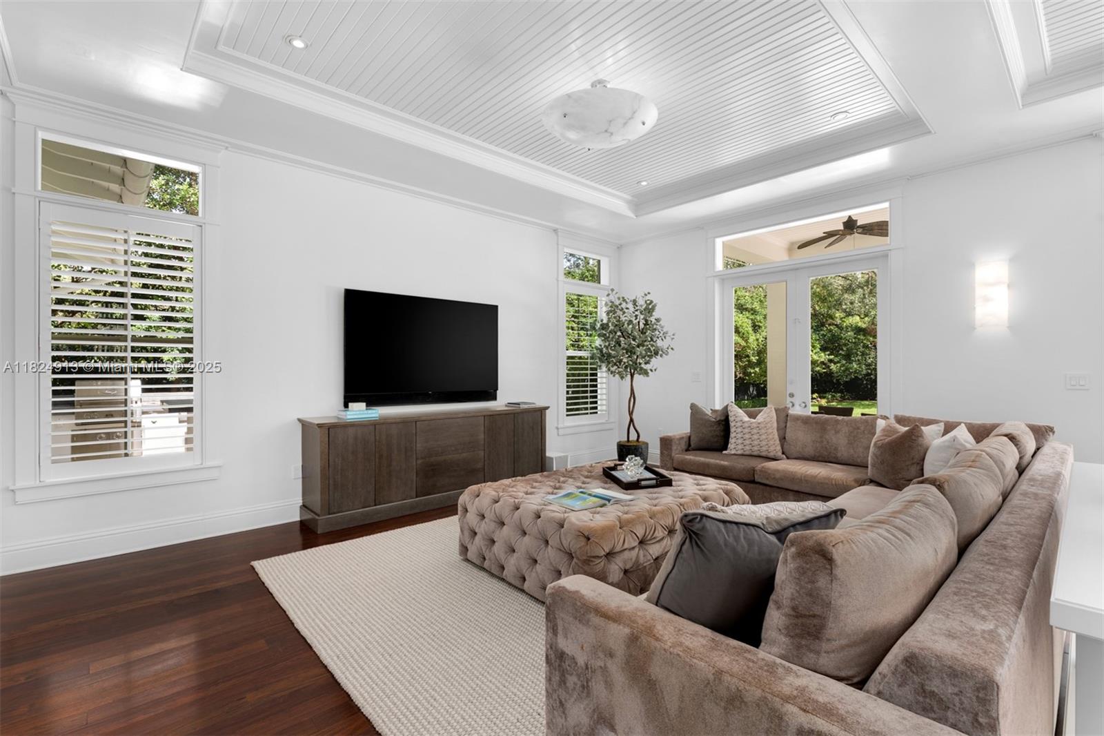 7415 Southwest 49th Place Miami, FL 33143 - Photo 16 of 60 a living room with furniture and a flat screen tv