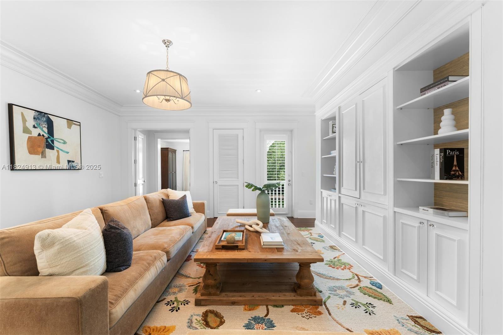 7415 Southwest 49th Place Miami, FL 33143 - Photo 24 of 60 a living room with furniture wooden floor and a large window