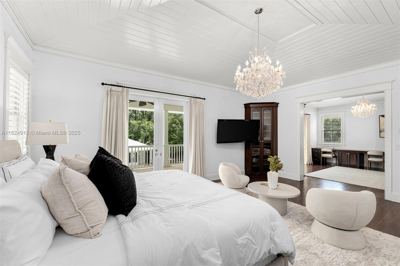 7415 Southwest 49th Place Miami, FL 33143 - Photo 27 of 60 a bedroom with a bed and a flat screen tv