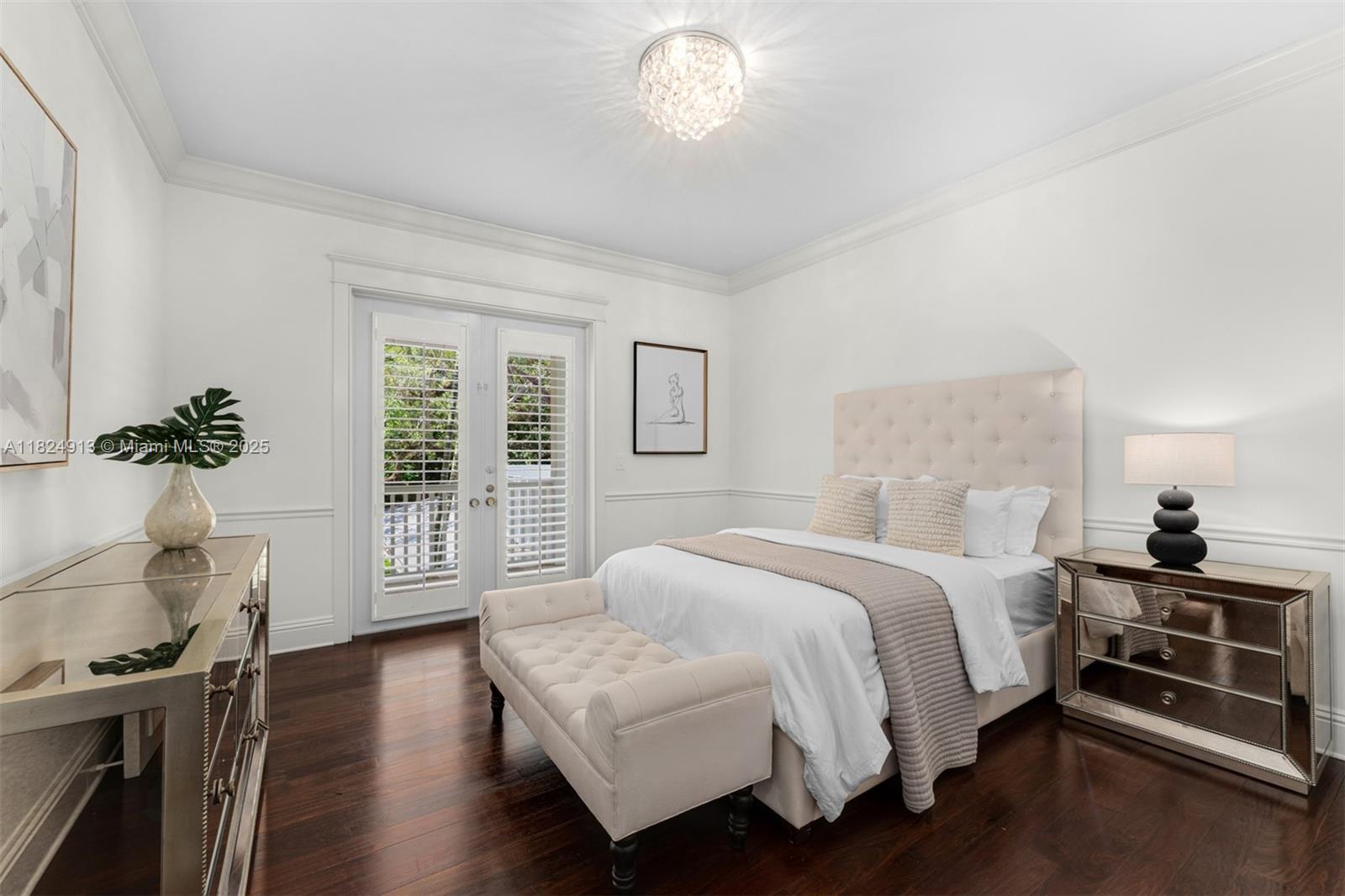7415 Southwest 49th Place Miami, FL 33143 - Photo 33 of 60 a bedroom with a bed and wooden floor