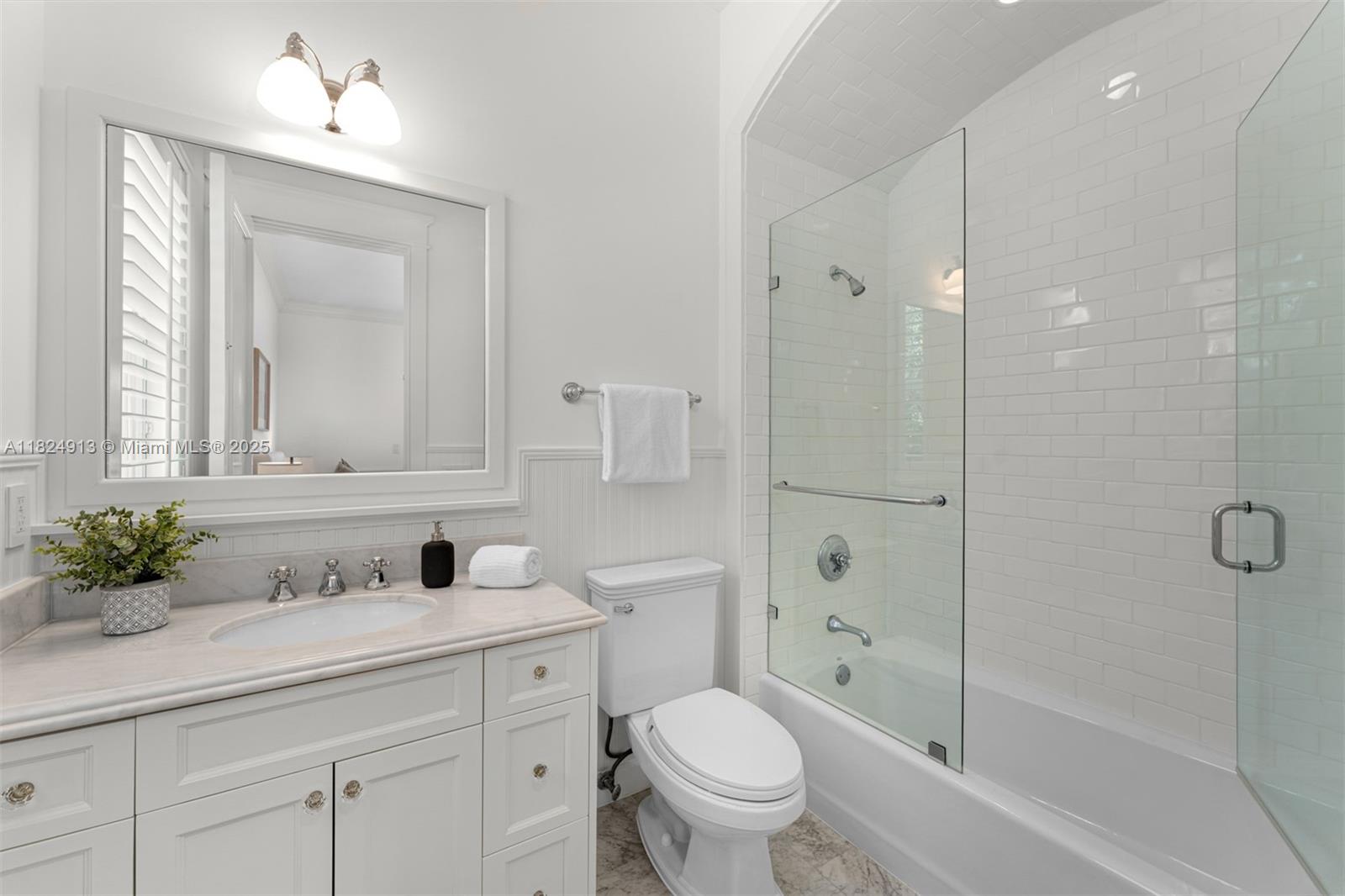 7415 Southwest 49th Place Miami, FL 33143 - Photo 38 of 60 a bathroom with a sink a toilet and shower