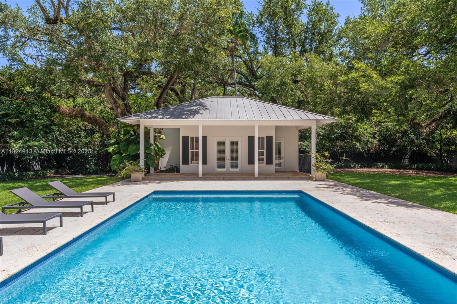 7415 Southwest 49th Place Miami, FL 33143 - Photo 42 of 60 a view of house with swimming pool and yard