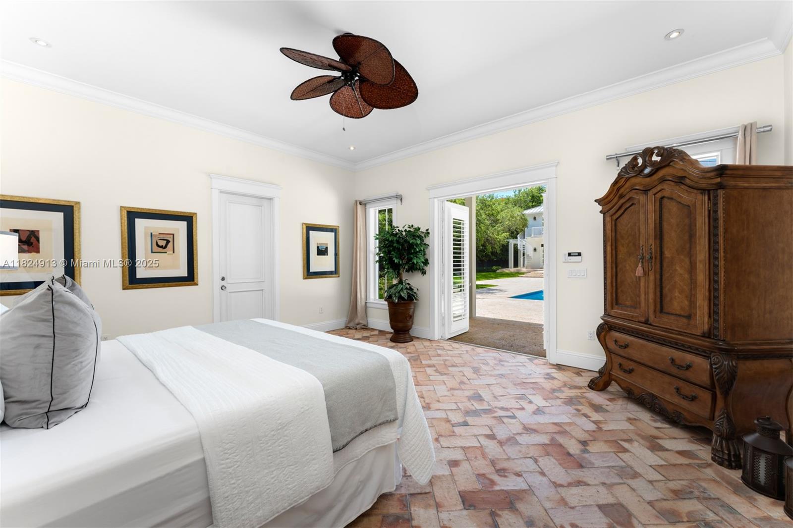 7415 Southwest 49th Place Miami, FL 33143 - Photo 44 of 60 a spacious bedroom with a bed and a walk in closet