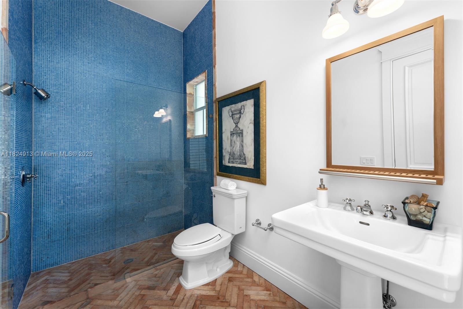 7415 Southwest 49th Place Miami, FL 33143 - Photo 46 of 60 a bathroom with a sink a toilet and shower