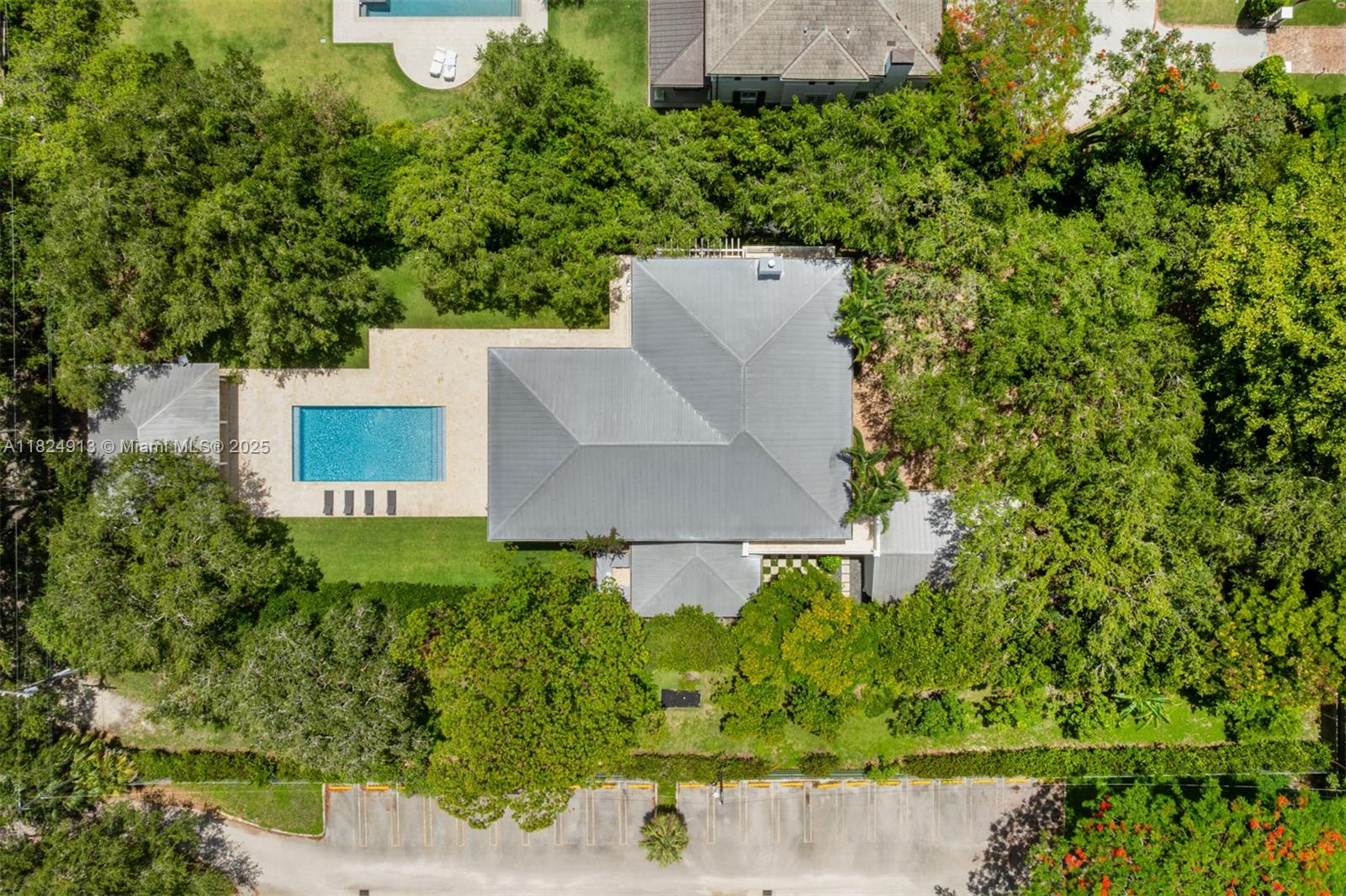 7415 Southwest 49th Place Miami, FL 33143 - Photo 52 of 60 an aerial view of a house with a yard and lake view