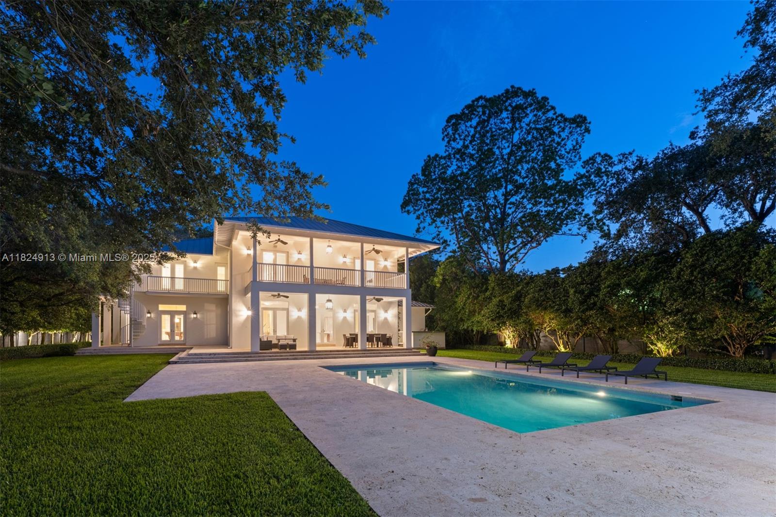 7415 Southwest 49th Place Miami, FL 33143 - Photo 58 of 60 a view of a house with swimming pool and garden