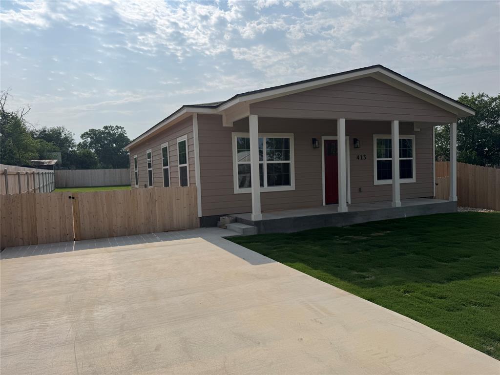 front view of a house with a yard