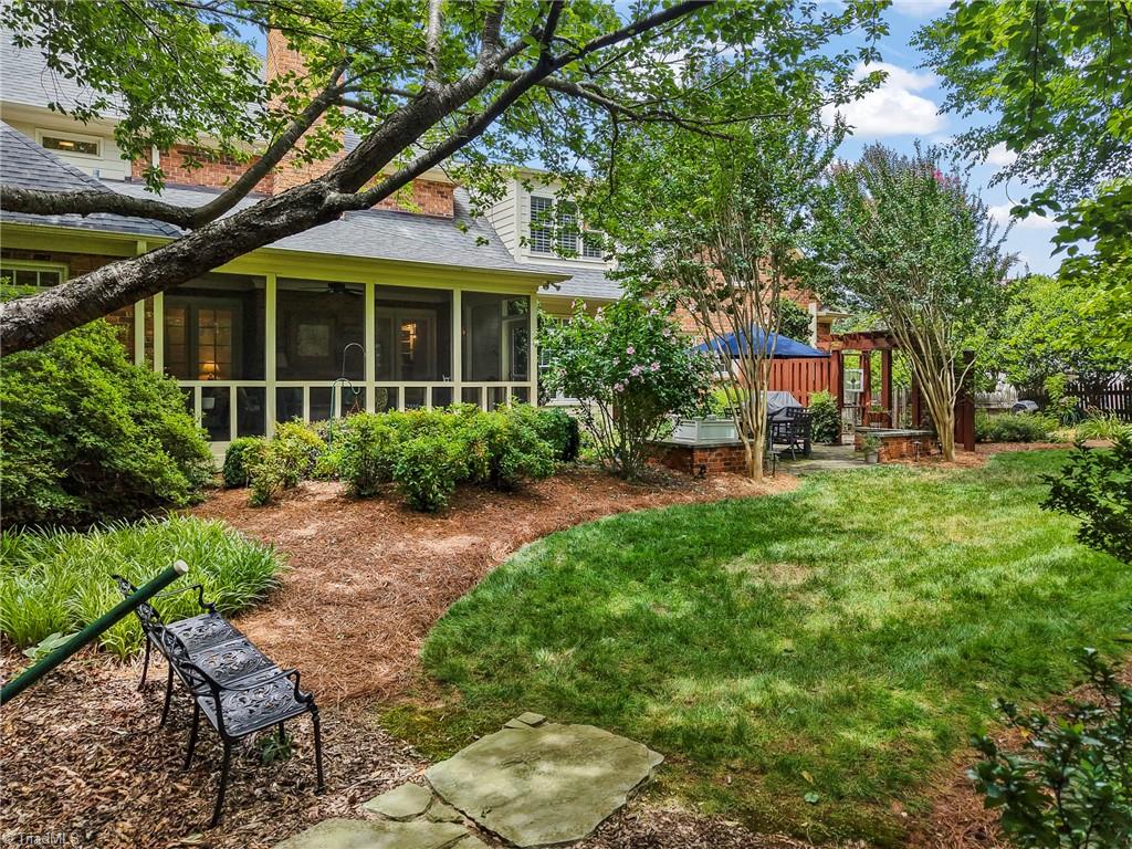 1457 Ridgemere Lane Winston-Salem, NC 27106 - Photo 32 of 39 The screened porch overlooks the private, fenced backyard
