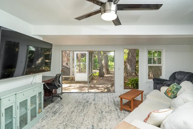 a bedroom with a bed and a table