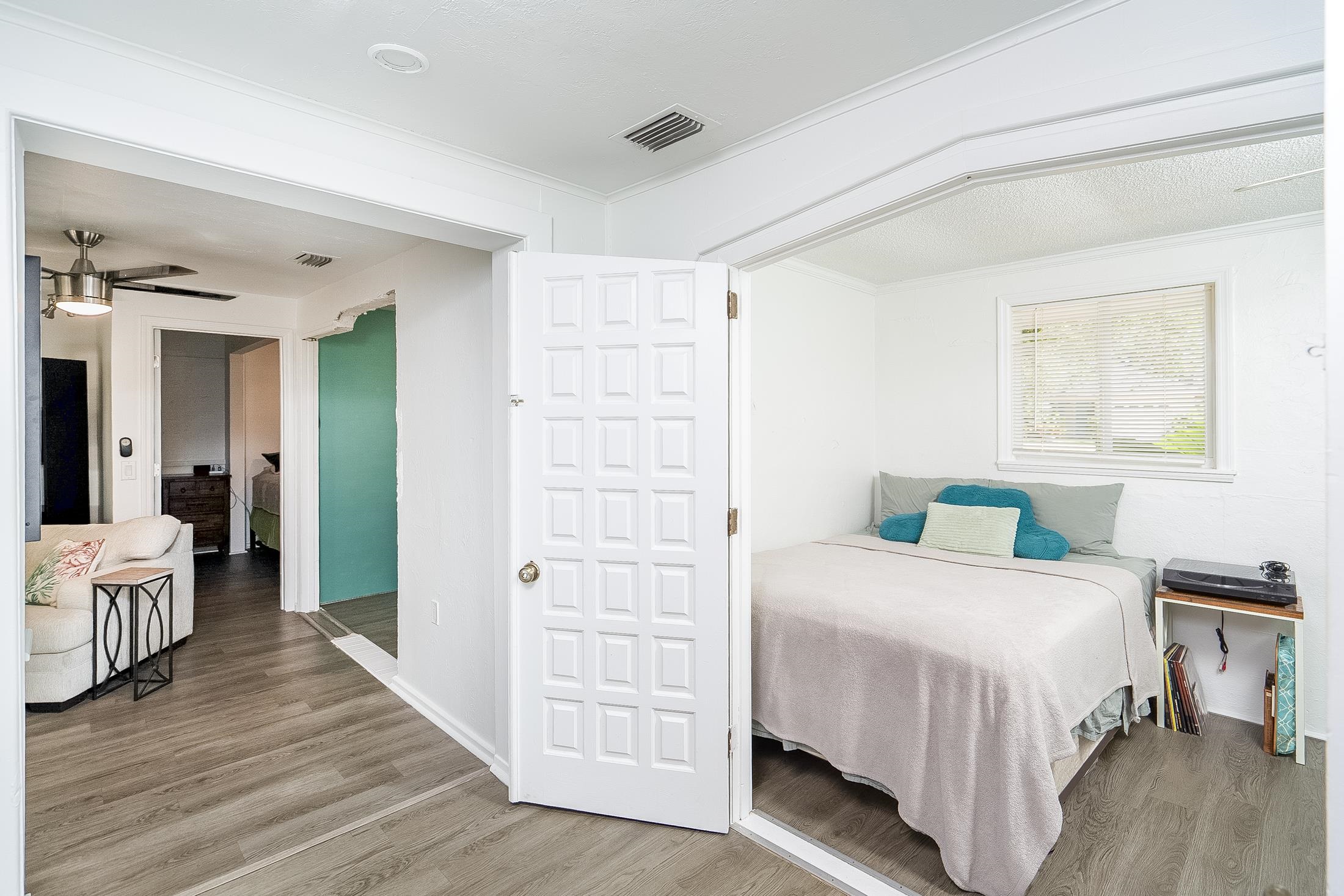 490 Pyrus Street St. Augustine, FL 32080 - Photo 15 of 35 a bedroom with a bed and a table