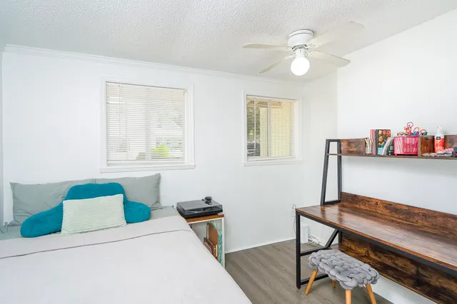 a view of a dining room with furniture and a window