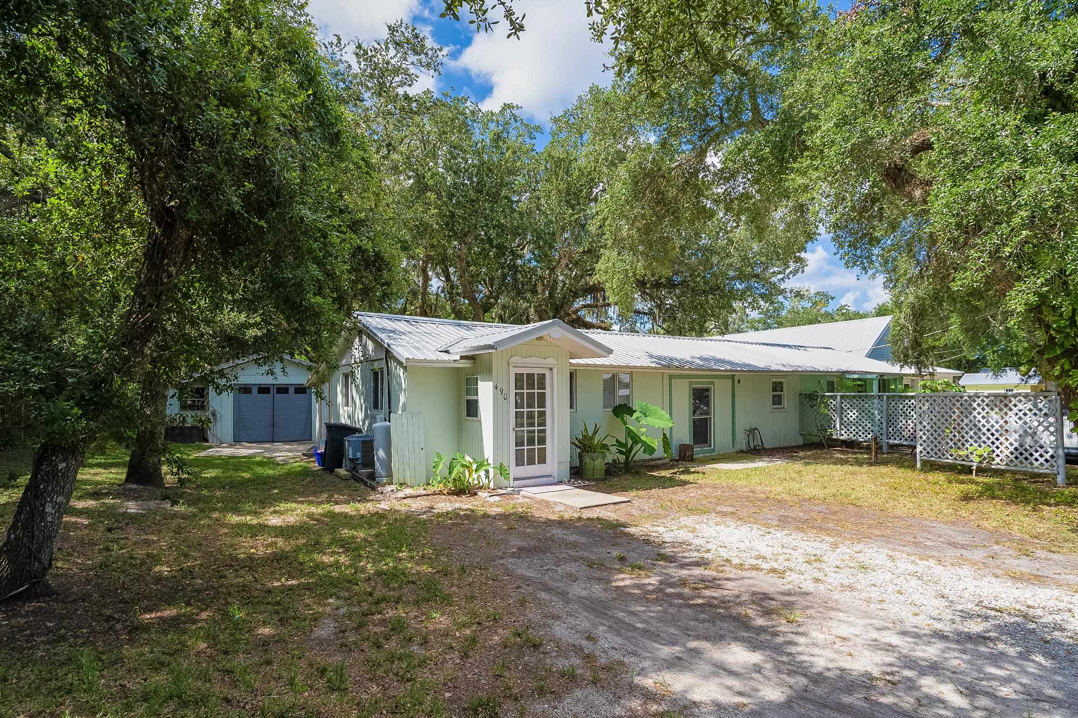 490 Pyrus Street St. Augustine, FL 32080 - Photo 2 of 35 a view of a house with a yard