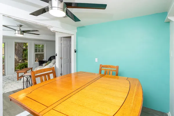 a bedroom with a bed and a flat tv screen on dresser