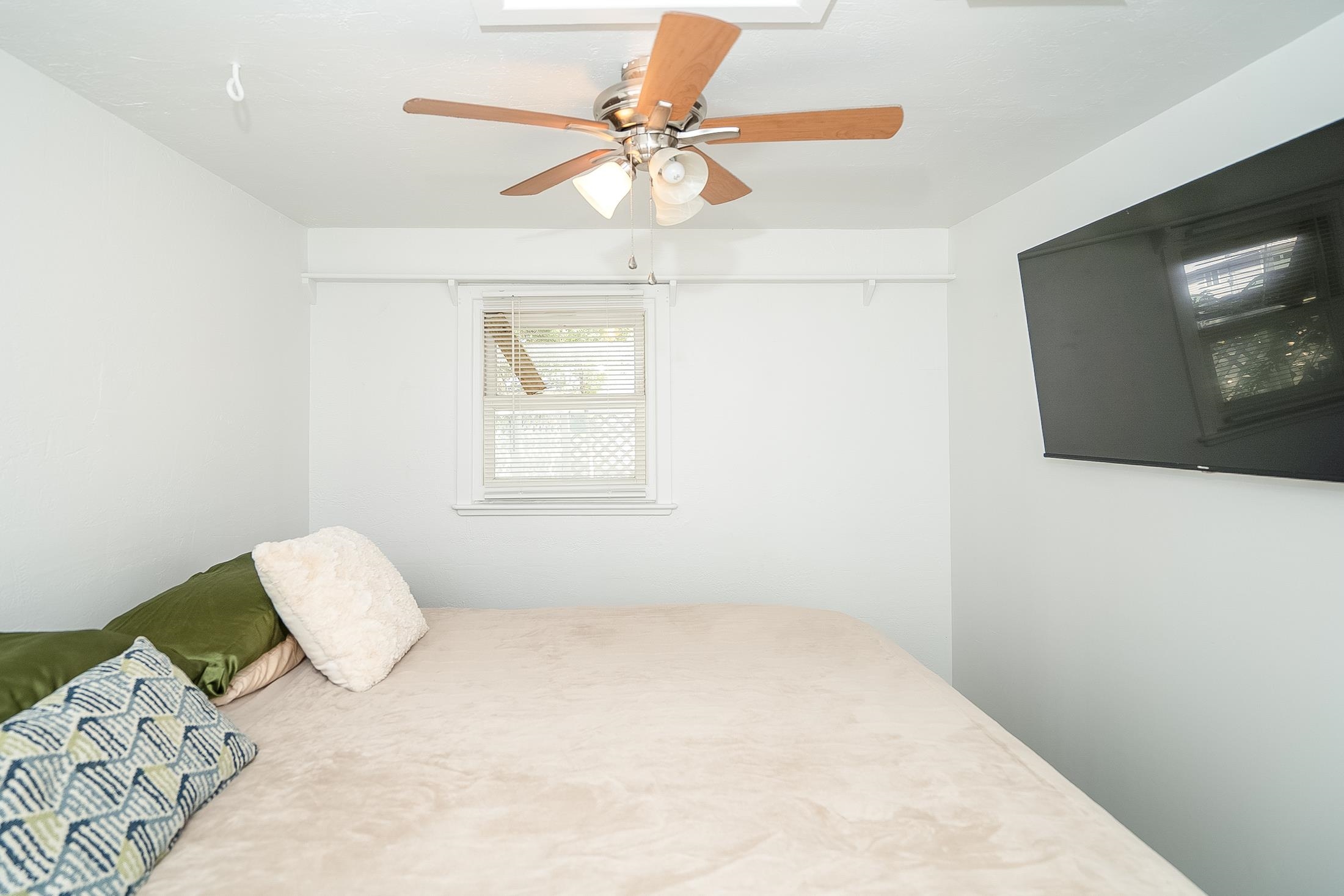 490 Pyrus Street St. Augustine, FL 32080 - Photo 24 of 35 a bedroom with a bed and a painting on the wall