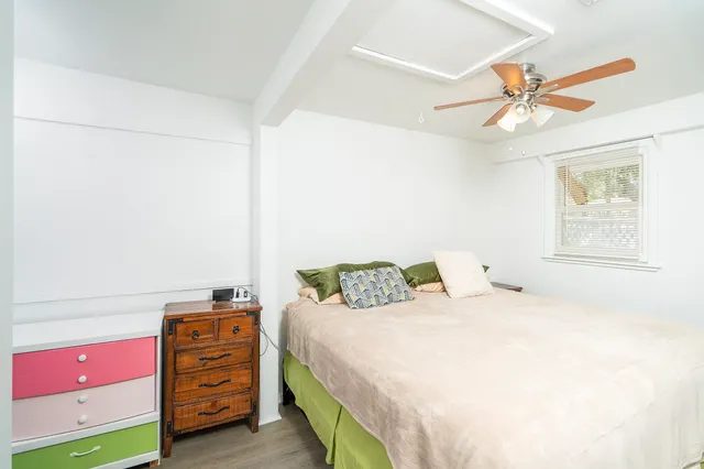 a view of a house with a tree in the forest