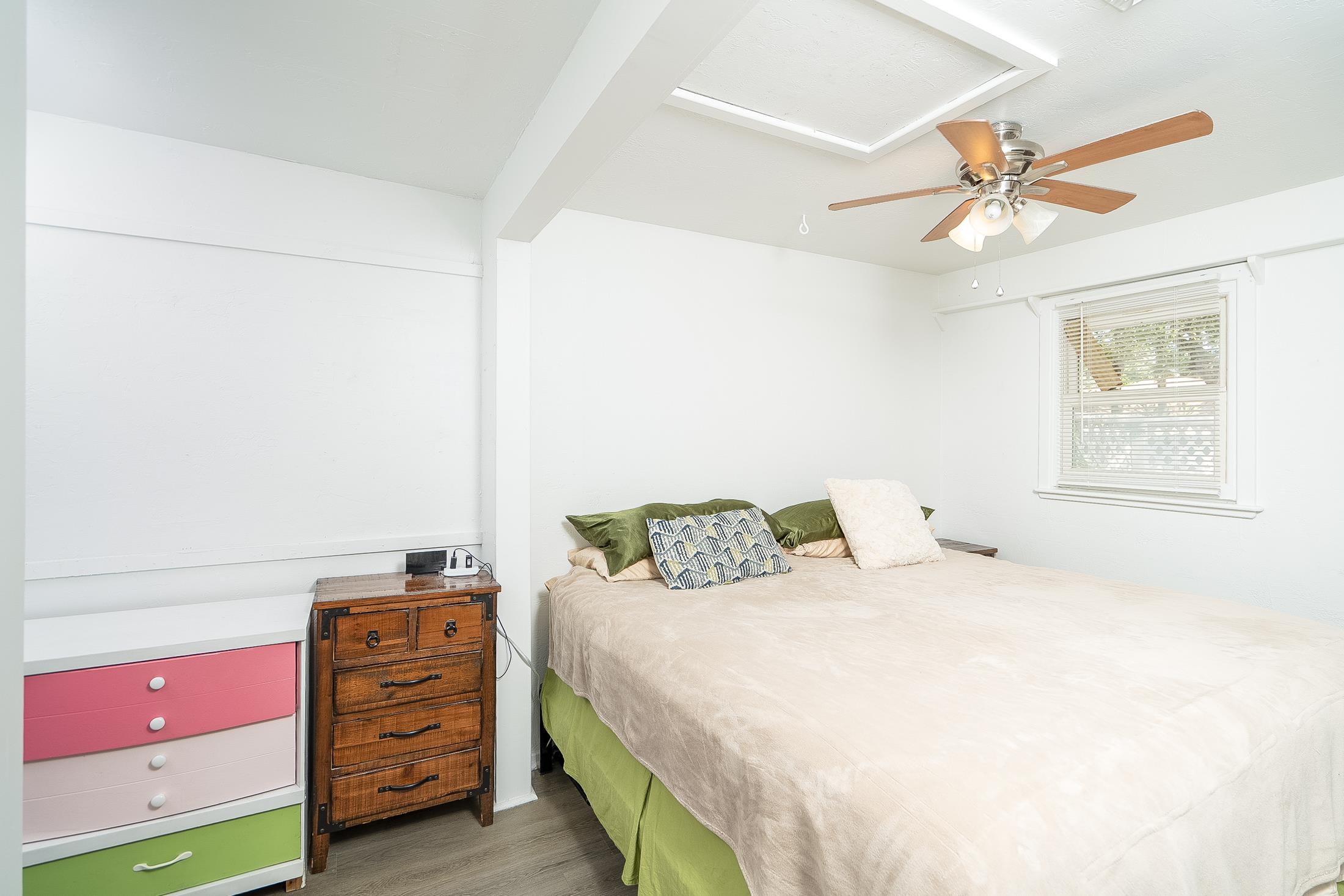 490 Pyrus Street St. Augustine, FL 32080 - Photo 25 of 35 a bedroom with a bed and a chandelier