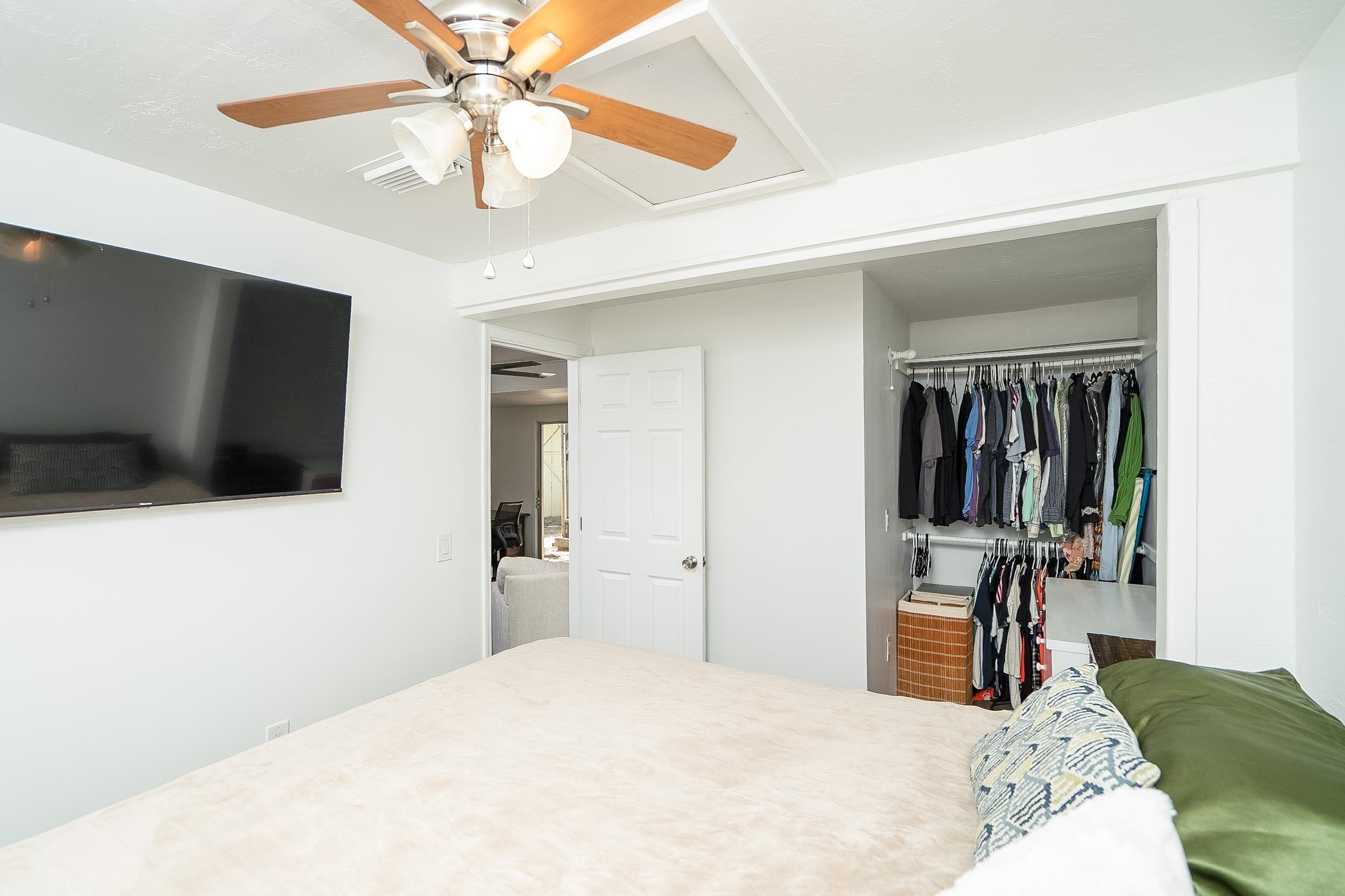 490 Pyrus Street St. Augustine, FL 32080 - Photo 27 of 35 a bedroom with a bed and a flat tv screen on dresser