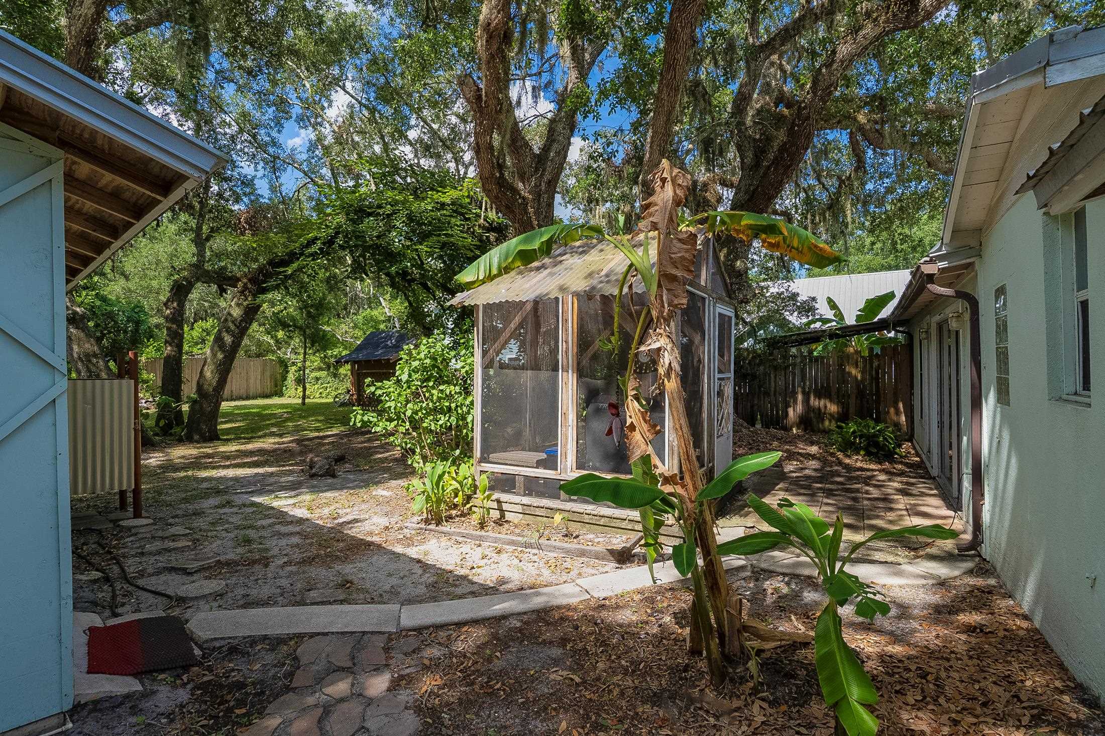 490 Pyrus Street St. Augustine, FL 32080 - Photo 31 of 35 a view of a house with yard and tree s
