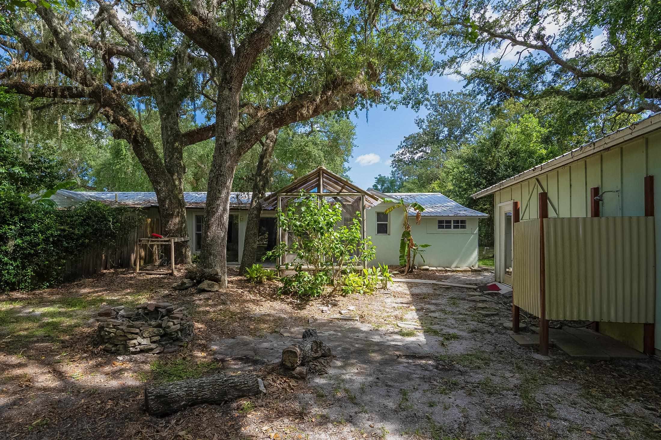 490 Pyrus Street St. Augustine, FL 32080 - Photo 4 of 35 a backyard of a house with lots of green space