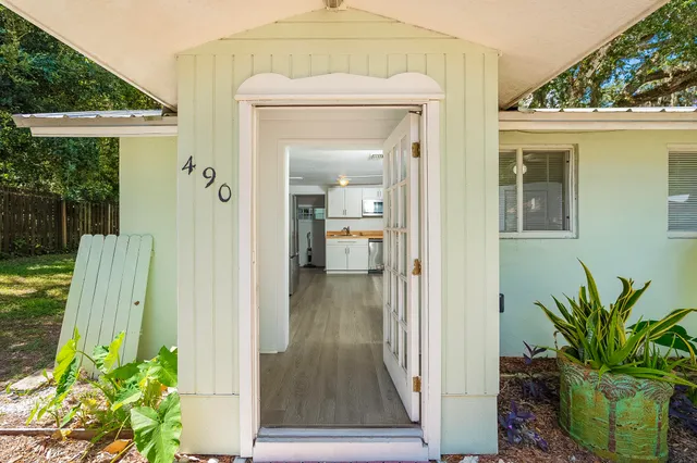 a kitchen with stainless steel appliances a stove microwave and cabinets