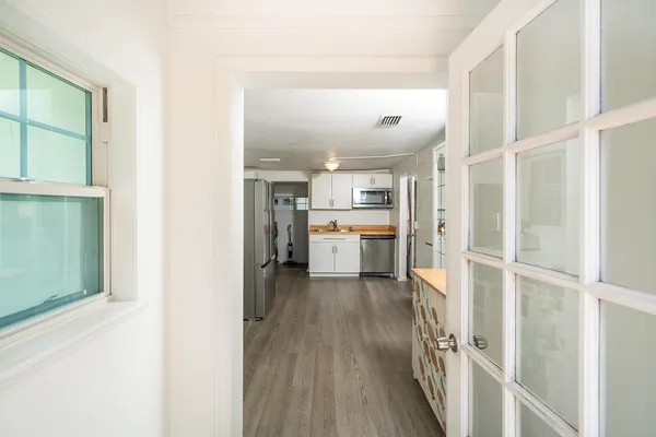 a kitchen with a stove sink and refrigerator