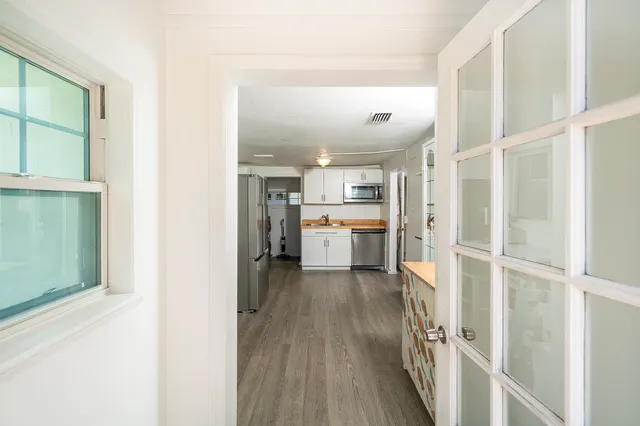 a kitchen with a stove sink and refrigerator