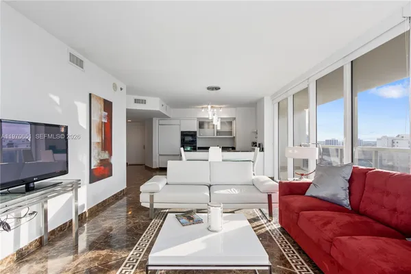 a living room with furniture and a flat screen tv