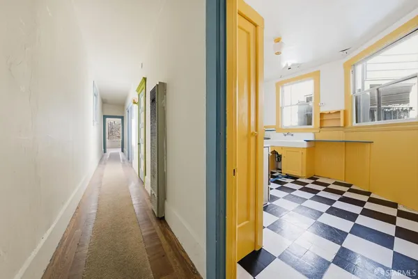 a view of a bathroom with a tub and shower