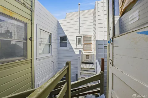 a view of balcony with wooden stairs