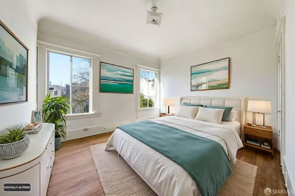 a bedroom with a large bed potted plant and a large window