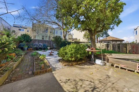 a view of a backyard with sitting area