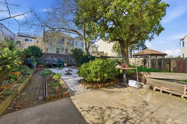 a view of a backyard with sitting area
