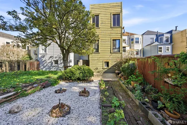 a view of a house with a yard and plants