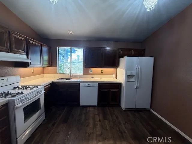 a kitchen with refrigerator and stove