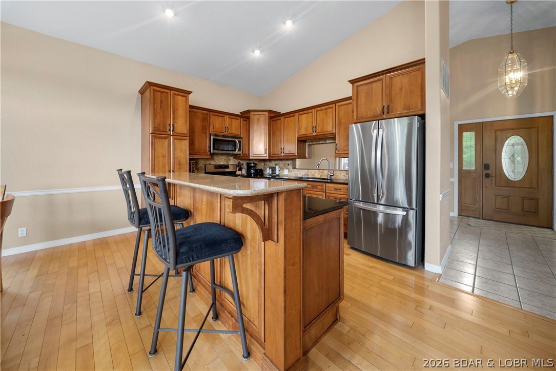 2247 Breezy Acres Road Osage Beach, MO 65065 - Photo 9 of 53 Kitchen island with seating area