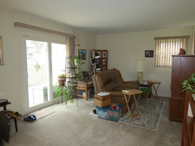 a work room with furniture and a window