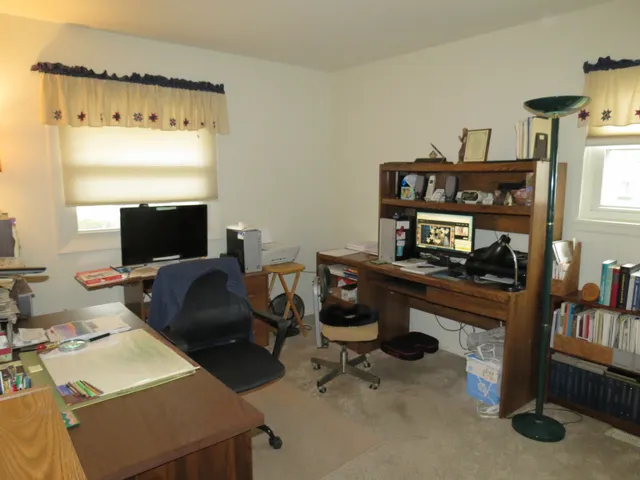 a view of a workspace with furniture