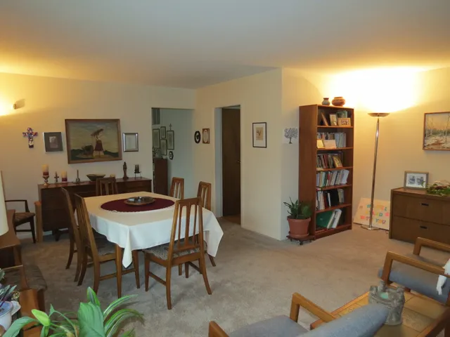 a kitchen with a table and chairs in it