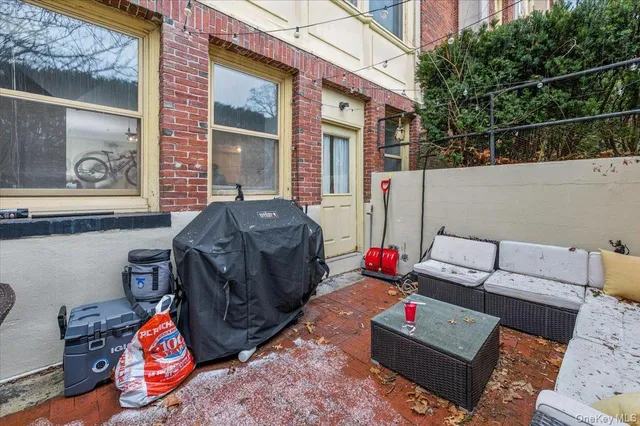 a backyard of a house with sofas