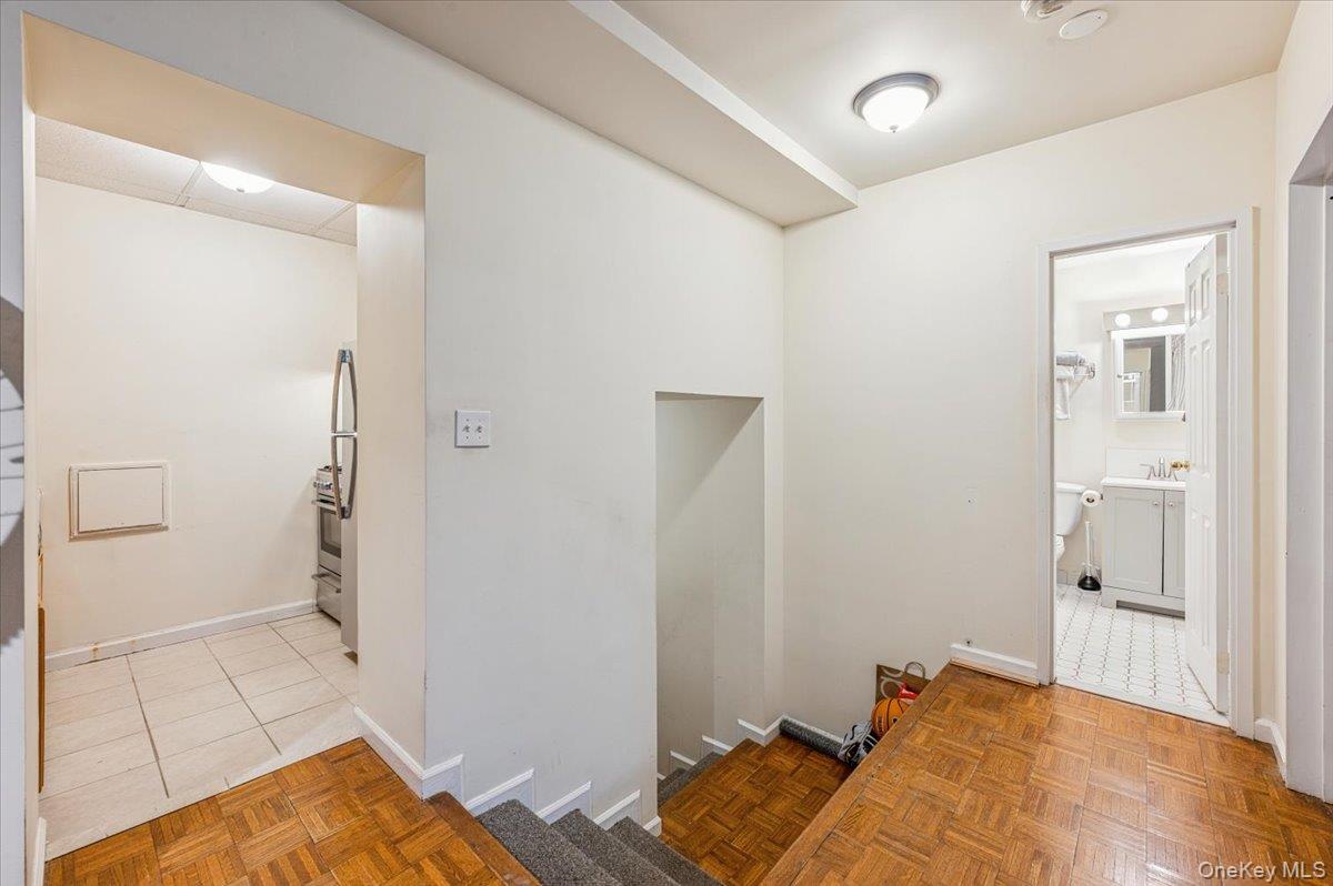 1250 North Avenue, Unit 115 New Rochelle, NY 10804 - Photo 12 of 16 a bed room with a bed and a view of bedroom