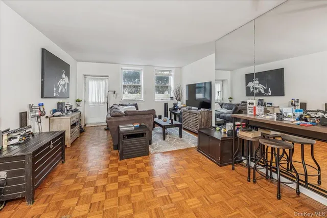 a living room with fireplace furniture and a flat screen tv