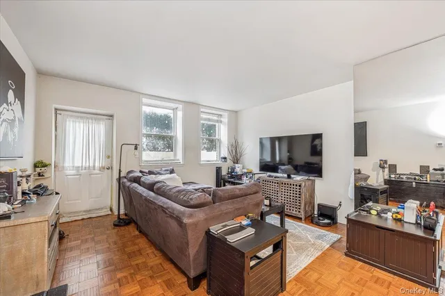 a living room with furniture or couch and a flat screen tv