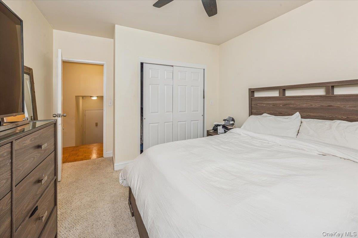 1250 North Avenue, Unit 115 New Rochelle, NY 10804 - Photo 9 of 16 a spacious bedroom with a bed and a flat screen tv