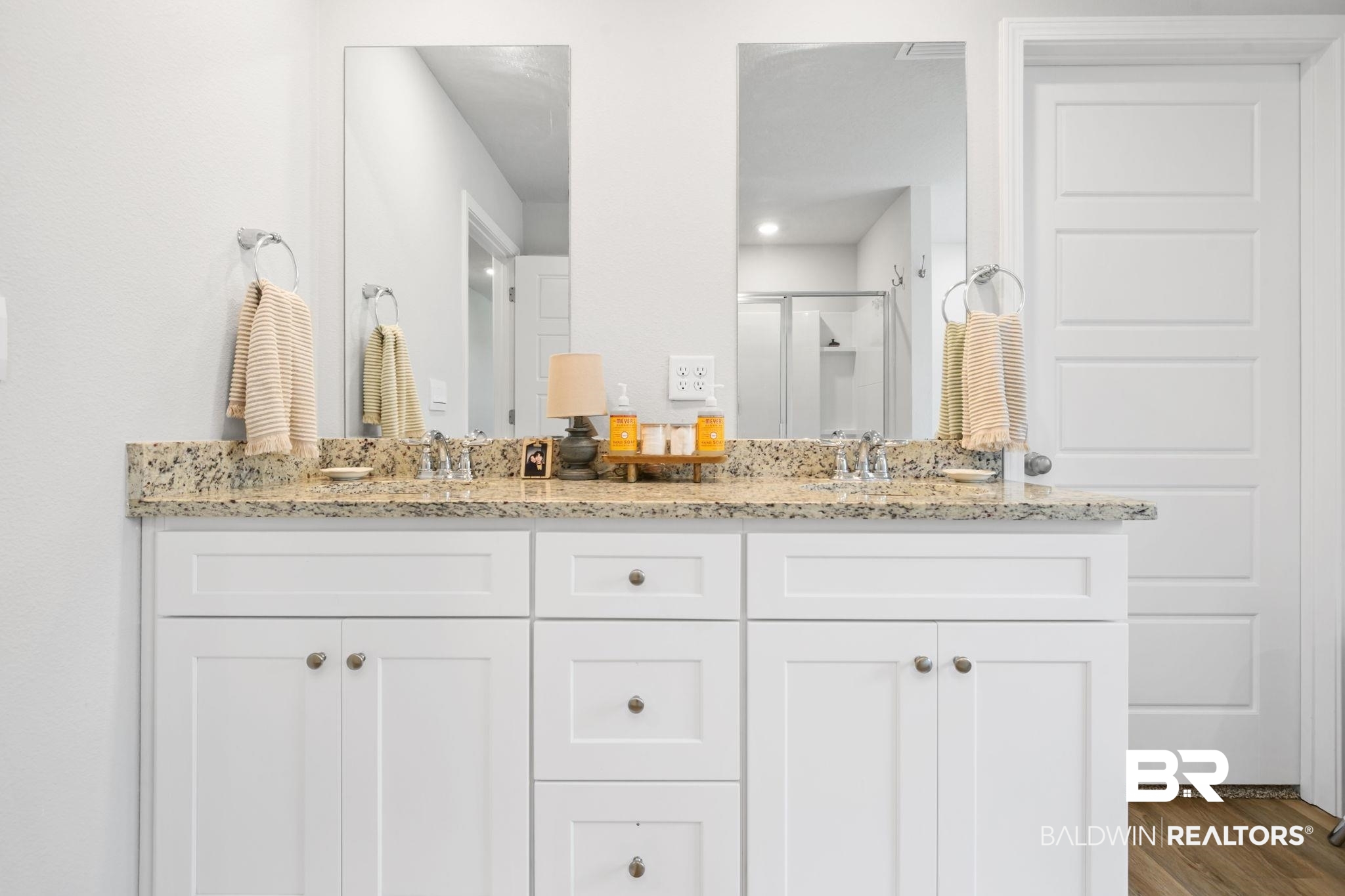 8021 Valor Rdg Way North Mobile, AL 36619 - Photo 29 of 34 Dual vanity with granite countertop and integrated sinks, complemented by individual mirrors and white shaker-style cabinetry