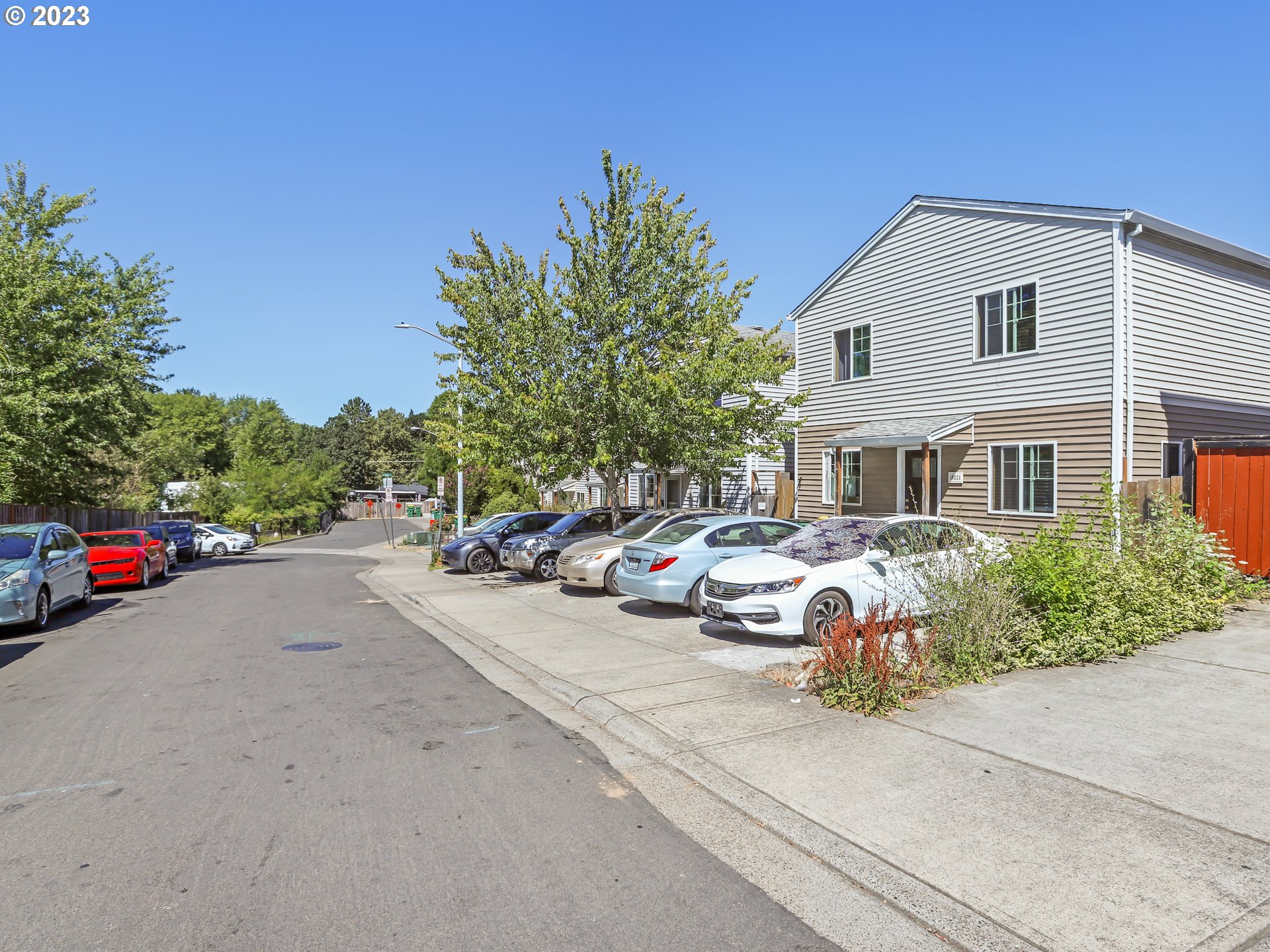 18533 Southwest Deloris Lane Beaverton, OR 97007 - Photo 13 of 43 a group of cars parked in front of a house