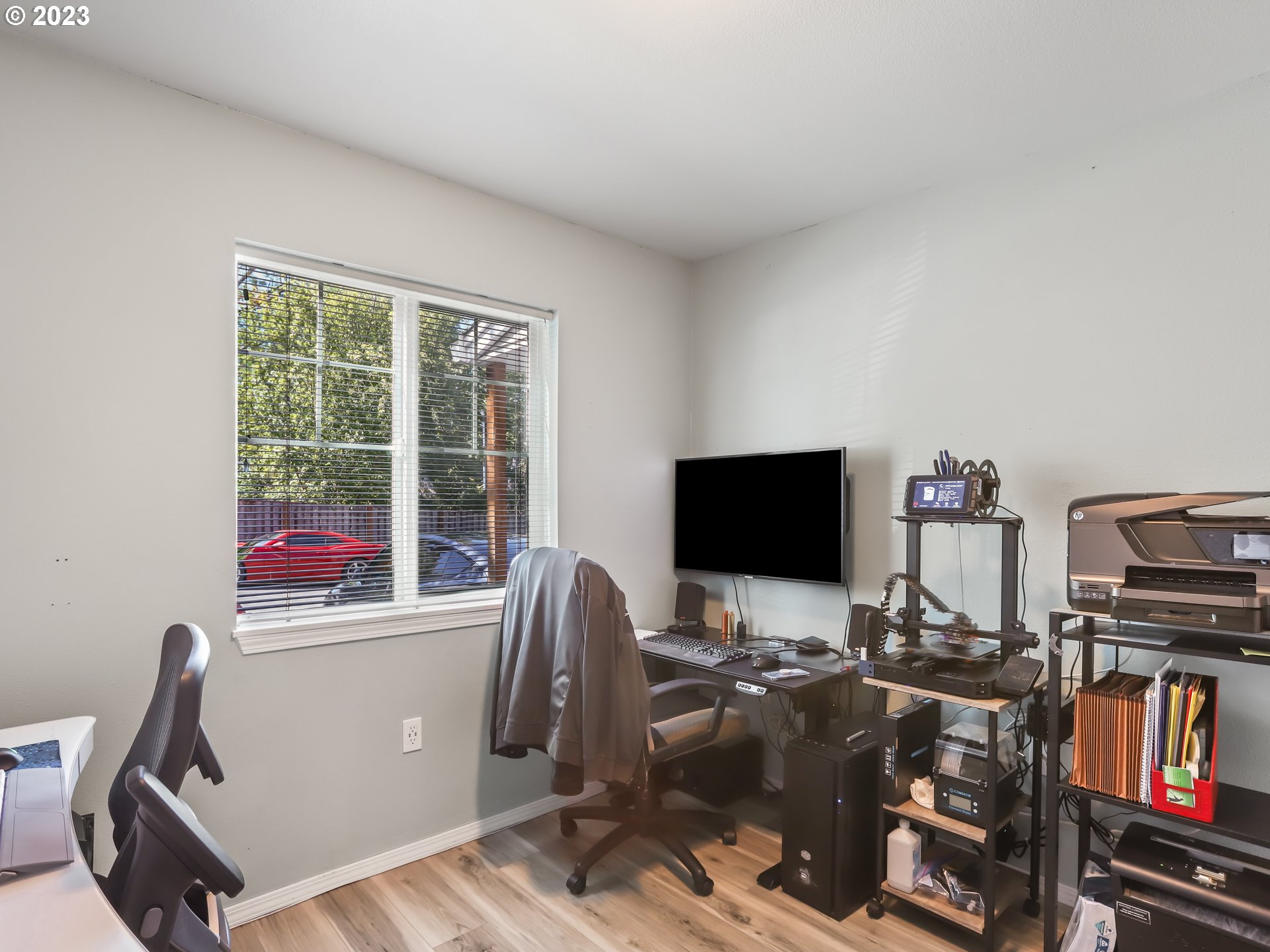 18533 Southwest Deloris Lane Beaverton, OR 97007 - Photo 15 of 43 a view of a workspace with furniture and a window