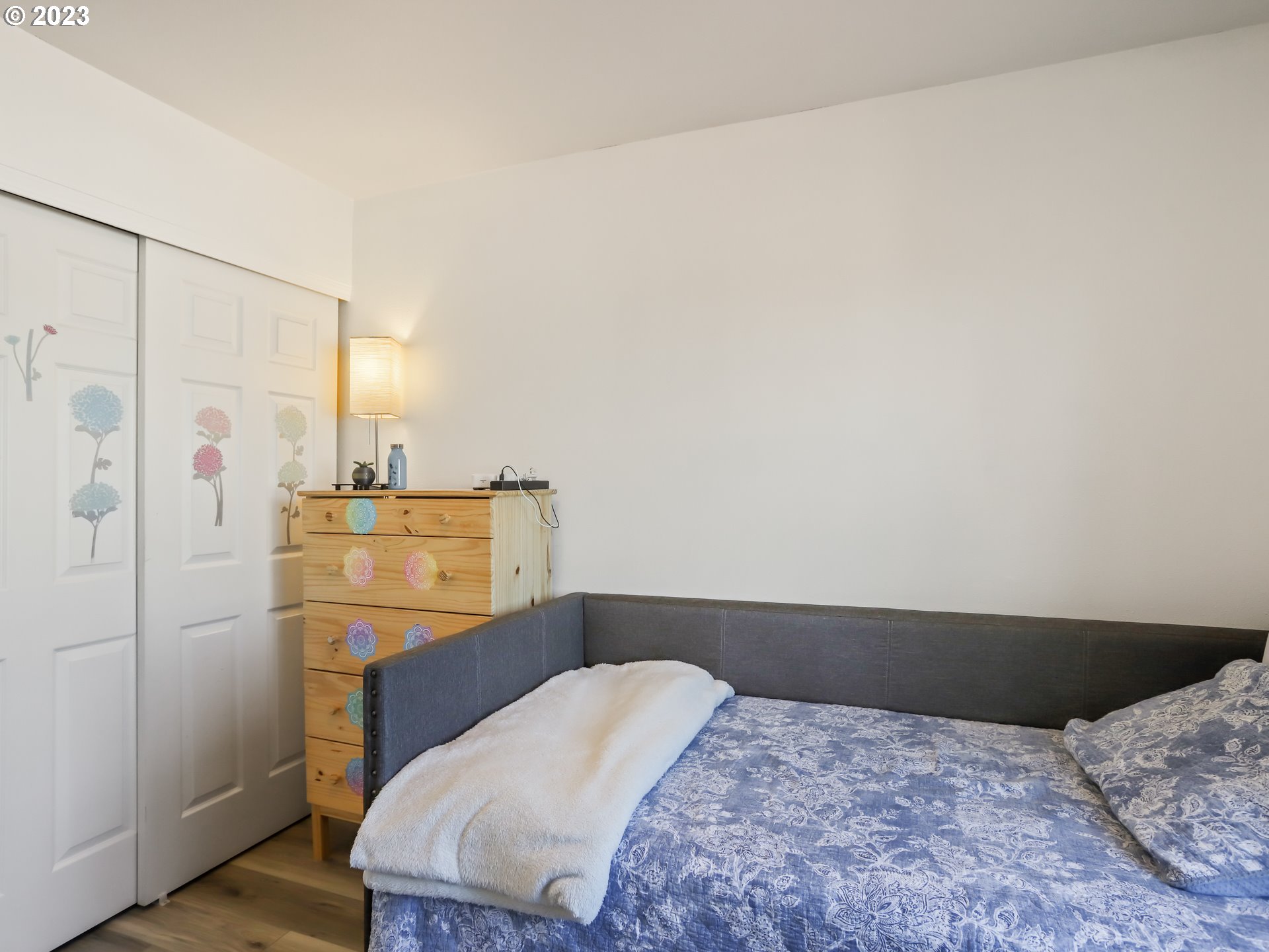 18533 Southwest Deloris Lane Beaverton, OR 97007 - Photo 21 of 43 a bedroom with a bed and wooden floor