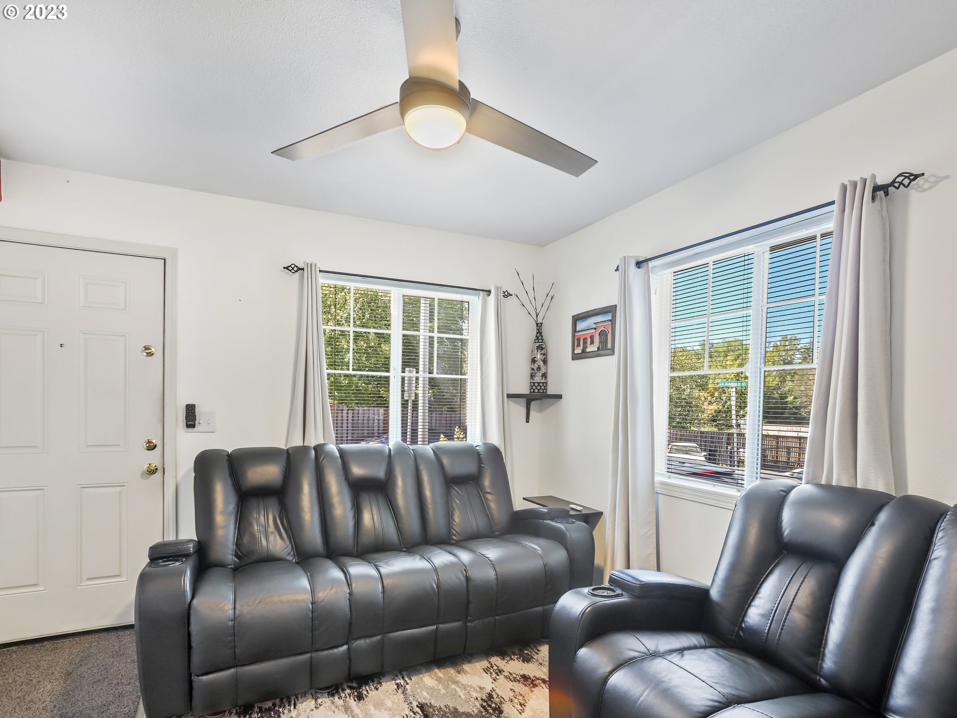 18533 Southwest Deloris Lane Beaverton, OR 97007 - Photo 3 of 43 a living room with furniture and a large window