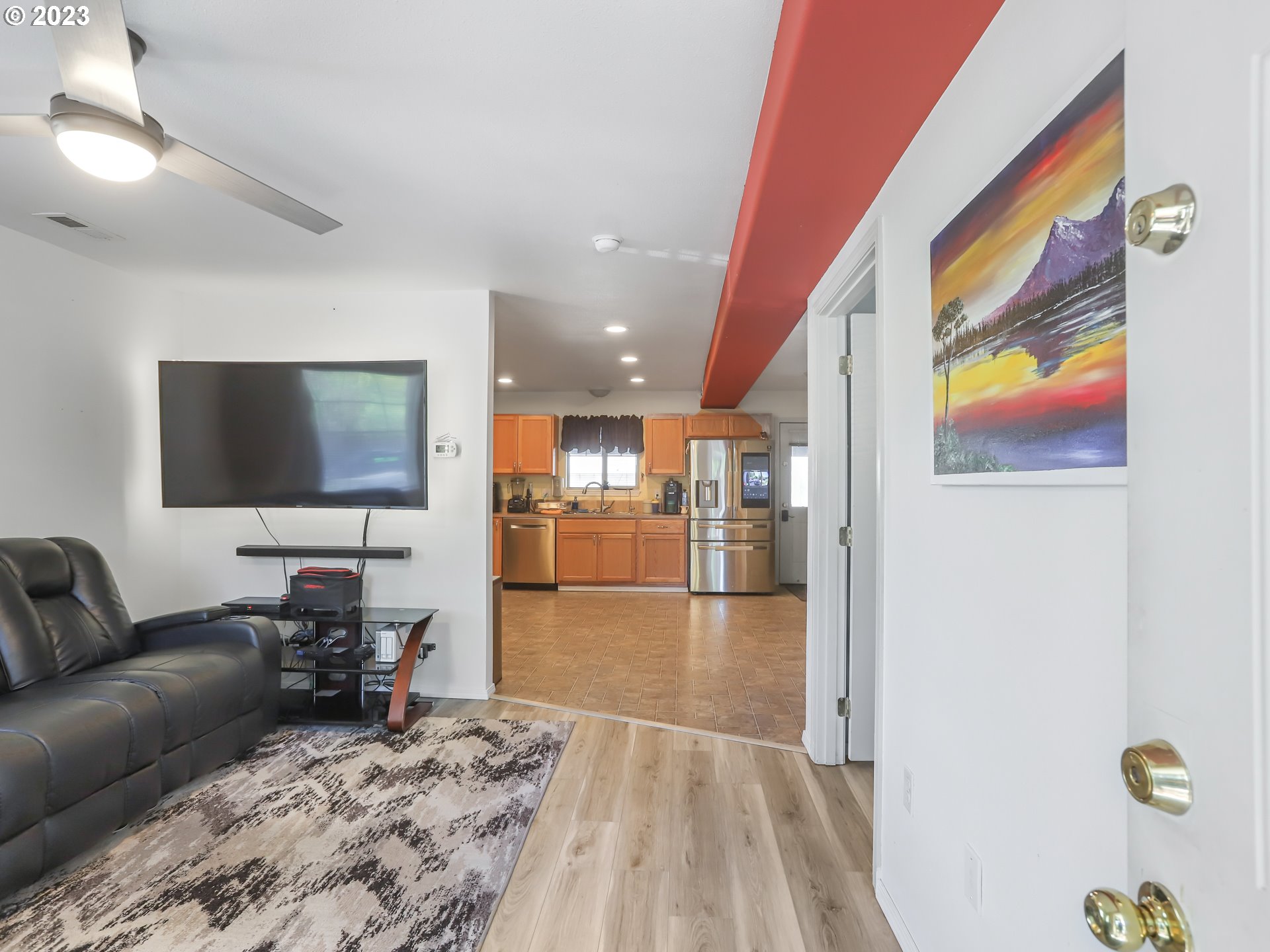 18533 Southwest Deloris Lane Beaverton, OR 97007 - Photo 42 of 43 a living room with furniture and a flat screen tv