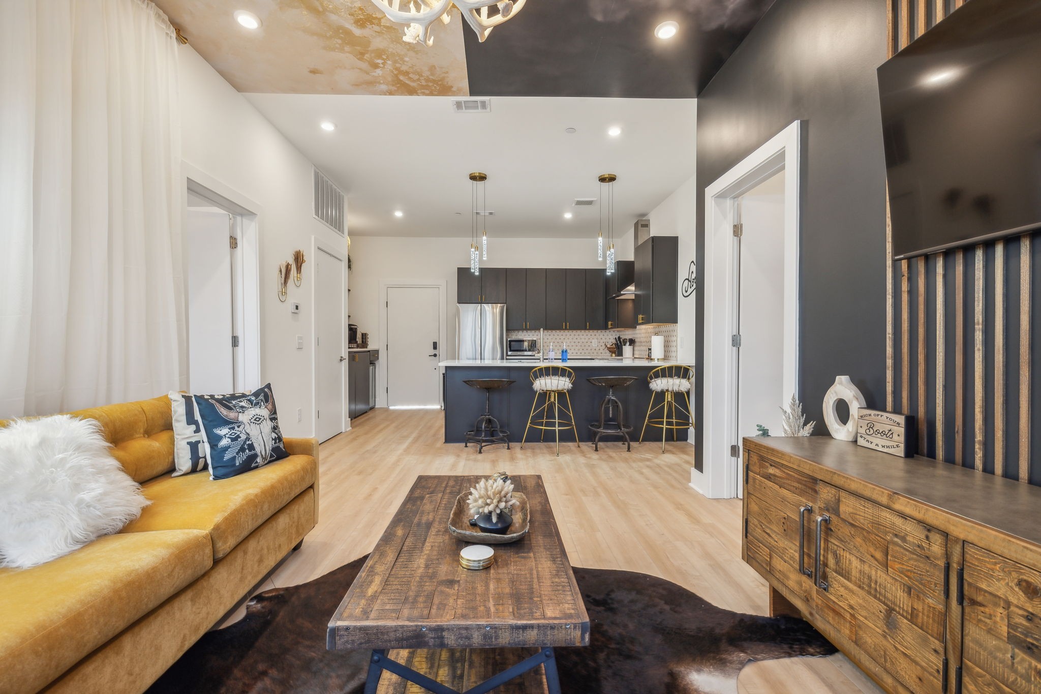 1310 Lischey Avenue, Unit 306 Nashville, TN 37207 - Photo 12 of 58 a living room with kitchen island furniture and a wooden floor